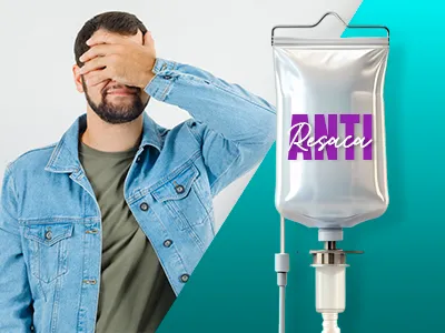 Hombre con dolor de cabeza junto a un suero intravenoso etiquetado como 'Anti Resaca'.